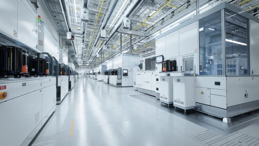 Wide Shot Of Bright Advanced Semiconductor Production Fab Cleanroom With Working Overhead Wafer Transfer System