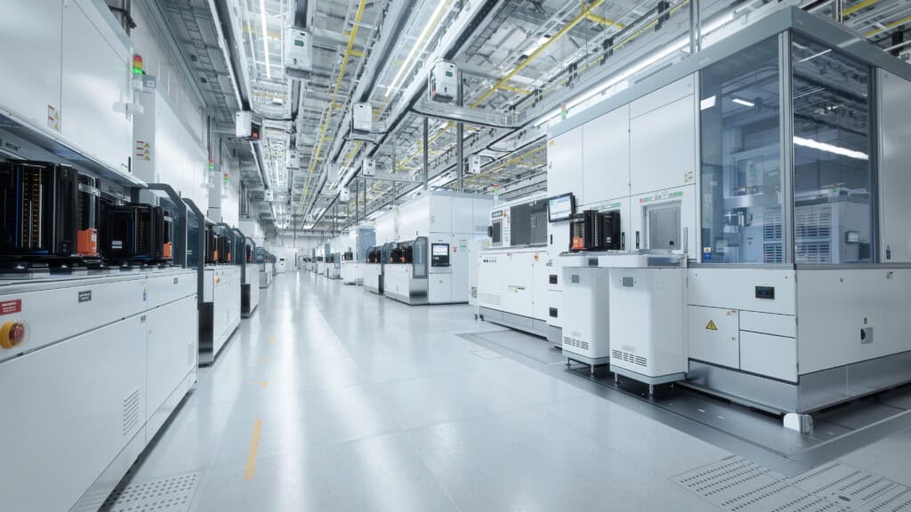 Wide Shot Of Bright Advanced Semiconductor Production Fab Cleanroom With Working Overhead Wafer Transfer System